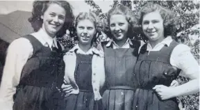  ?? ?? Violet, right, pictured at school with friends in 1948.