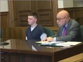  ?? ANDREW CASS — THE NEWS-HERALD ?? Michael Petro, left, a 17-year-old from Willowick, pleaded guilty Oct. 25 in Lake County Common Pleas Court to three charges stemming from a pair of robberies in the city. He faces up to 27 years in prison.