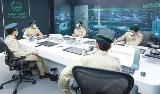  ??  ?? ↑
Senior officials of Dubai Police during the meeting.