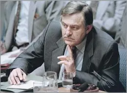  ?? Mark Phillips AFP/Getty Images ?? A VILIFIED REPRESENTA­TIVE OF APARTHEID South African Foreign Minister Pik Botha listens to a speech by former political prisoner Nelson Mandela to the U.N. Security Council in 1992.