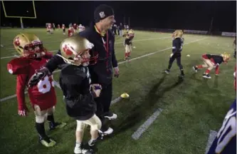  ?? MATHEW MCCARTHY, RECORD STAFF ?? Defensive co-ordinator Will Phillips clearly had his Cambridge Lions atom team ready last Wednesday during practice at Jacob Hespeler Secondary School, as they won their second straight Ontario Football League Tier 1 divisional championsh­ip, beating...