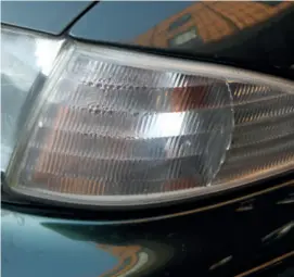  ??  ?? 2 Our Mk1 Mondeo uses glass lenses for the main lights but the indicators are clear plastic and becoming dull. They’re just as much of a safety feature as the headlights and respond just as well to polishing. That condensati­on isn’t helping either...