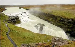  ??  ?? Some visitors edge as close as possible to Iceland’s waterfalls, such as Gullfoss.