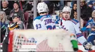  ?? DARRYL DYCK/THE CANADIAN PRESS VIA AP ?? Chris Kreider, back right, and Mika Zibanejad celebrate Zibanejad’s goal against the Canucks on Feb. 28. Kreider and the New York Rangers have put last season out of their mind and are focusing on the future.