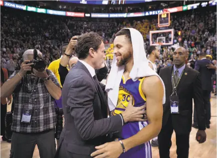  ?? Carlos Avila Gonzalez / The Chronicle ?? Stephen Curry greets Utah head coach Quin Snyder after the Warriors completed a playoff sweep of the Jazz.