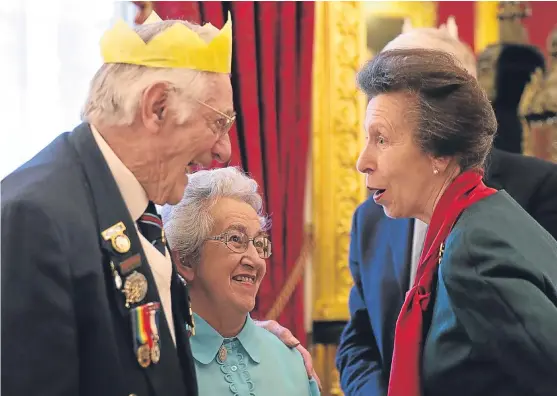  ?? PA. ?? The Princess Royal with Normandy veteran Gordon Smith, 92, of the Royal Engineers, and his partner Wendy Plant, 80, during a Christmas Party for The Not Forgotten Associatio­n at St James’s Palace.