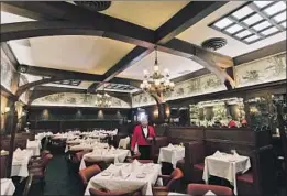  ?? THE DINING ROOM Calvin B. Alagot Los Angeles Times ?? at Musso & Frank Grill in Hollywood. The 100-year-old landmark is suffering because it wasn’t set up for outdoor dining or takeout.