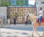  ??  ?? Police and private security personnel outside Mukesh Ambani's residence Antilia, on Friday.