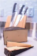  ?? ?? Beehive Cheese Company’s Barely Buzzed cheddar cheese rubbed with espresso and lavender is displayed at Shea Cheese’s new storefront in Phoenix on Nov. 10.