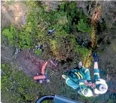  ??  ?? A St John paramedic is winched down from the Taranaki Rescue Helicopter to where a 30 ton digger crashed down a bank near Raetihi on December 16.