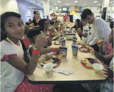  ?? Photos Satish Kumar for The National ?? Orphans play games and enjoy a meal at the Chuck E Cheese restaurant at an iftar hosted yesterday by Ibn Battuta Mall in Dubai. After the youngsters broke their fast, volunteers took the children shopping for Eid gifts