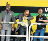  ?? Picture: THULI DLAMINI ?? GOING NOWHERE: Thousands turned up to show support for embattled President Jacob Zuma in eDumbe, KwaZulu-Natal, yesterday. He’s flanked by Siyabonga Nene, left, and Supa Zuma