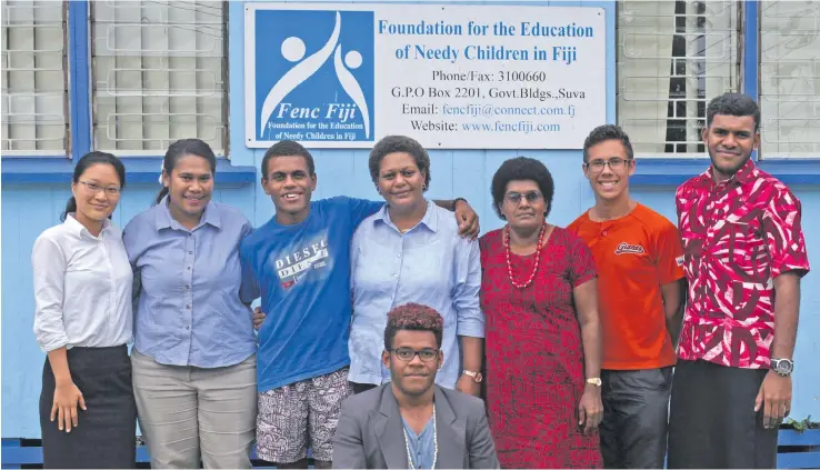  ?? Photo: Wati Talebula ?? Ratu Manoa Misikana Rokotavaga (third from left), with the Foundation for the Education of Needy Children (FENC) staff members.
