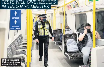  ?? PHOTO: TFL ?? British Transport Police check mask use on the Tube