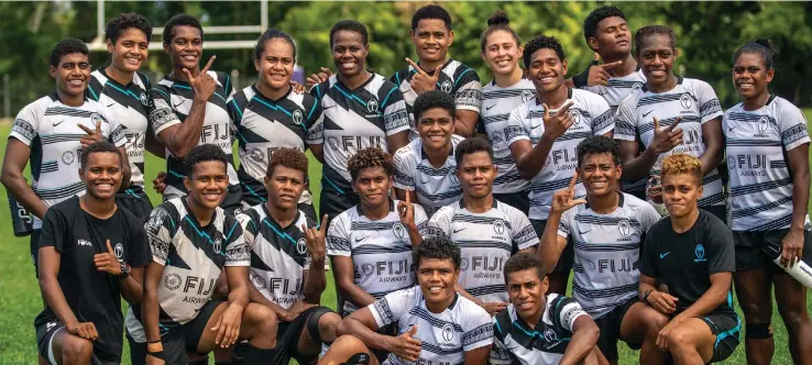  ?? Photo: Leon Lord ?? Sitting (from left) Rusila Nagasau and Reapi Uluinasau with the extended squad members of the Fiji Airways Fijiana 7s team following their scrimmage session with the Dominion Brothers at Bidesi Park,Suva on April 20, 2023.