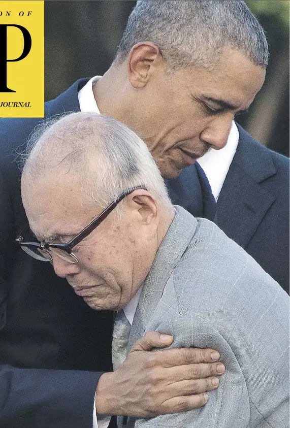  ?? JIM WATSON / AFP / GETTY IMAGES ?? U.S. President Barack Obama embraces Shigeaki Mori, a survivor of the 1945 bombing of Hiroshima, as he paid tribute to the victims.
