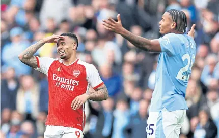  ?? REUTERS ?? Arsenal’s Gabriel Jesus, left, and Manchester City’s Manuel Akanji react during their Premier League match on Sunday.