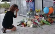  ?? JOE CAVARETTA — SOUTH FLORIDA SUN-SENTINEL VIA AP ?? Junko Sasaki of Japan cries at a memorial for Jose Fernandez at Marlins Park in Miami after the game against the Atlanta Braves was canceled because of the death of pitcher Jose Fernandez, Sunday in Miami Beach.