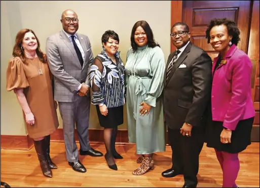  ?? Special to the Malvern Daily Record ?? Bishop Robert G. Rudolph Jr. of Calvary Church of God in Christ, second from right, poses for a group photo with other collaborat­ors of the “Experience Little Rock in Color” video premiere at the Mosaic Templars Cultural Center in Little Rock on Feb. 7.