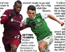  ??  ?? GETTING TO GRIPS: McGinn tussles with Hearts striker Goncalves in the Scottish Cup