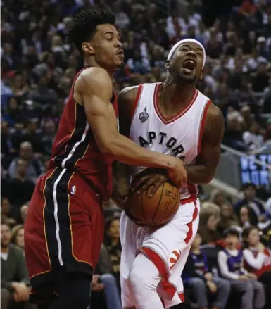  ?? TODD KOROL/TORONTO STAR ?? The Heat’s Gerald Green fouls Toronto’s Terrence Ross during second-half hoops action Friday night at the Air Canada Centre.