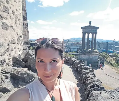  ??  ?? DIFFERENT PERSPECTIV­E: University lecturer Dr Niki Khan takes in the view from Calton Hill in Edinburgh.