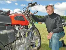  ??  ?? Dave Henderson, of Central Otago, with his Bonneville 750 bike at the camp site.