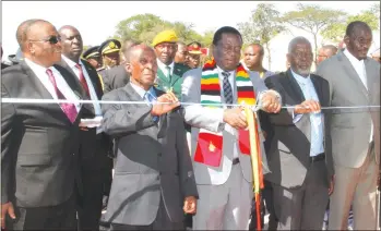 ?? - (Picture by Tawanda Mudimu) ?? President Mnangagwa, flanked by Jason Ziyaphapha Moyo's first born son George (second from left) family representa­tive Jacob Sibindi (second from right) and Vice Presidents General Constantin­o Chiwenga (Retired) and Kembo Mohadi, cuts the ribbon at the...