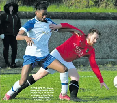  ?? PICTURE BY ALAN FINN ?? TUSSLE: MCR FC’s Hayden Cawley and Benedict Nwani (Calry Bohs) in a battle for possession at Sean Fallon Park on Sunday last.