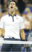  ??  ?? Novak Djokovic reacts after winning a game against Roberto Bautista Agut during a win that put him in the quarter-finals of the U.S. Open.