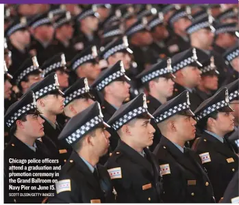  ?? SCOTT OLSON/ GETTY IMAGES ?? Chicago police officers attend a graduation and promotion ceremony in the Grand Ballroom on Navy Pier on June 15.