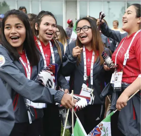  ?? RICHARD LAUTENS/TORONTO STAR PHOTOS ?? Members of Team Yukon share some laughs and cheers prior to the ceremony that began the North American Indigenous Games in North York Sunday.