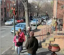  ?? TRENTONIAN FILE PHOTO ?? People walk along Mercer st during the 51st Annual Mill Hill Holiday House Tour.