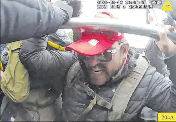  ?? The Associated Press ?? A police body-cam image shows Taylor James Johnatakis during the U.S. Capitol riot on Jan. 6, 2021, in Washington, D.C. Johnatakis has been sentenced to prison time.