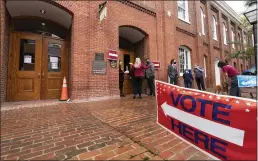  ?? ALEX BRANDON — THE ASSOCIATED PRESS FILE ?? Voters arrive to cast the their ballots on Election Day at City Hall in Alexandria, Va., on Tuesday.