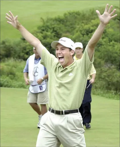  ?? The Maui News / MATTHEW THAYER photo ?? Sergio Garcia raises his arms on the Kapalua Plantation Course’s 18th green after winning the 2002 Tournament of Champions in a playoff with David Toms. Garcia, who won the Sanderson Farms Championsh­ip in October, is set to play in next week’s TOC, making his first appearance at Kapalua since 2006.