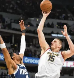  ?? DAVID ZALUBOWSKI/ASSOCIATED PRESS ?? Nuggets center Nikola Jokic (right) is averaging 24.7 points, 11.5 rebounds and 10.1 assists coming out of the All-star break, shooting 63% from the field and 39% from 3-point range.