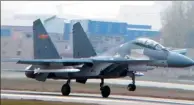  ??  ?? A J-11B twin-engine fighter jet carrying a large missile leads to speculatio­n of a new air-to-air missile.