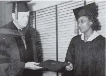  ?? 1952 ZION COLLEGE YEARBOOK ?? Wilma L. Sadler, the first graduate of Zion College’s commerce department, receives her certificat­e of secretaria­l science from Dr. George Salstrand, dean of the college.