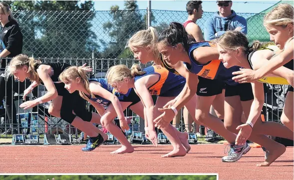  ??  ?? Fast start . . . Girls in the grade 9 100m take off from the start line at the Colgate Games at the Caledonian 1 Ground during the weekend.Left: Invercargi­ll’s Quinn Hartley lears 1.93m to win the boys grade 14 high jump. cl Below: Jess Hendrew (North Canteerbur­y) soars over the bar during the girls grade 13 high jump