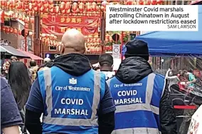 ?? SAM LAWSON ?? Westminste­r Covid marshals patrolling Chinatown in August after lockdown restrictio­ns eased