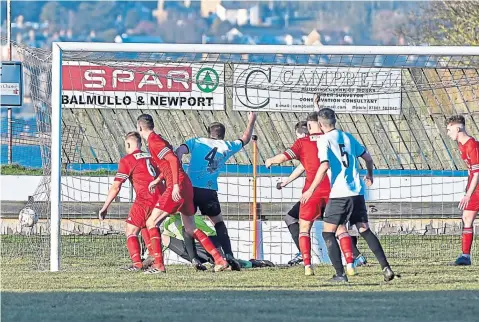  ??  ?? Whitburn scramble in a last-minute winner against Tayport at The Canniepair­t in the Super League.