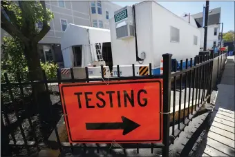  ?? NANCY LANE / HERALD STAFF FILE ?? THIS WAY: A sign leads to COVID testing at the Bowdoin Street Health Center.