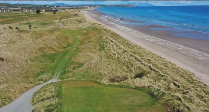  ?? Picture: Ken Finegan ?? It’s difficult not to be distracted by the stunning views of the Irish Sea, Clogherhea­d and the Mourne Mountains when you line up your tee shot at Seapoint’s 17th hole.