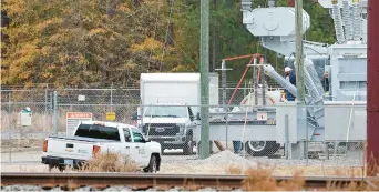  ?? KARL B DEBLAKER/AP ?? Workers repair equipment Wednesday at a substation in West End, North Carolina.