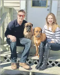  ?? SUBMITTED PHOTO ?? The dogs with their new owners, Amanda Macneil and Matt Fukala.