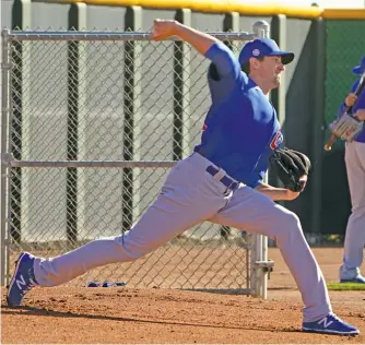  ?? AP PHOTOS ?? Kris Bryant (top left), batting in a spring-training game this week, could be among the Cubs who are traded. Kyle Hendricks is “massively underrated,” according to handicappe­r Tom Barton.