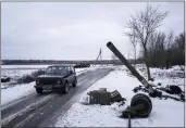  ?? ?? A car drives past a destroyed tank at the former positions of Russian forces in Ridkodub village, Ukraine, on Wednesday.