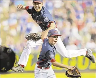  ?? AP ?? Michael Mancini (r.) and Jude Abbadessa celebrate after winning the LLWS United States championsh­ip, advancing to the final to face South Korea on Sunday.