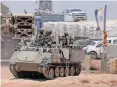  ?? | AFP ?? ISRAELI military vehicles along the border with the Palestinia­n territory yesterday.